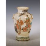 A Japanese Satsuma pottery vase, Meiji Period, decorated with two pairs of figures, with loop