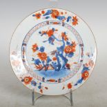 A Chinese porcelain Imari plate, Qing Dynasty, decorated with a garden of peony, chrysanthemum and