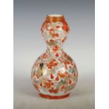 A Japanese Kutani double gourd vase, Meiji Period, decorated with crickets, snail, dragonfly and