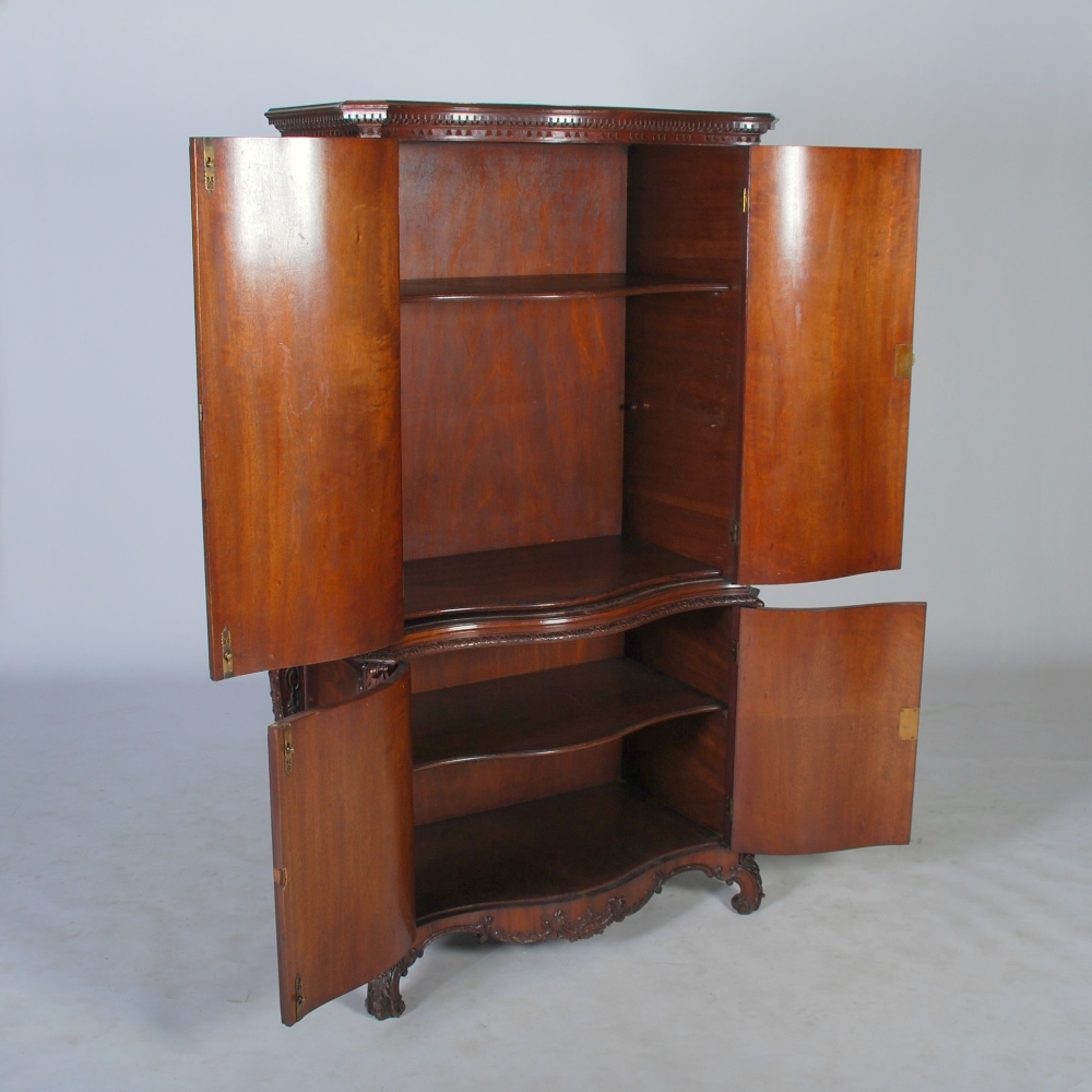 A George III style mahogany serpentine cupboard, the moulded cornice and dentil frieze above a - Image 2 of 4