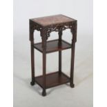 A Chinese dark wood jardiniere stand, Qing Dynasty, the rectangular top with a mottled red and white