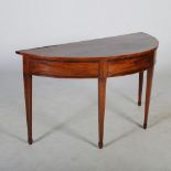 A 19th century mahogany and boxwood lined demi lune serving table, the shaped top above a central