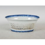 A Chinese porcelain blue and white oval-shaped basket, Qing Dynasty, decorated on the interior