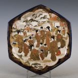 A Japanese Satsuma pottery blue ground hexagonal-shaped dish, Meiji Period, decorated with figures