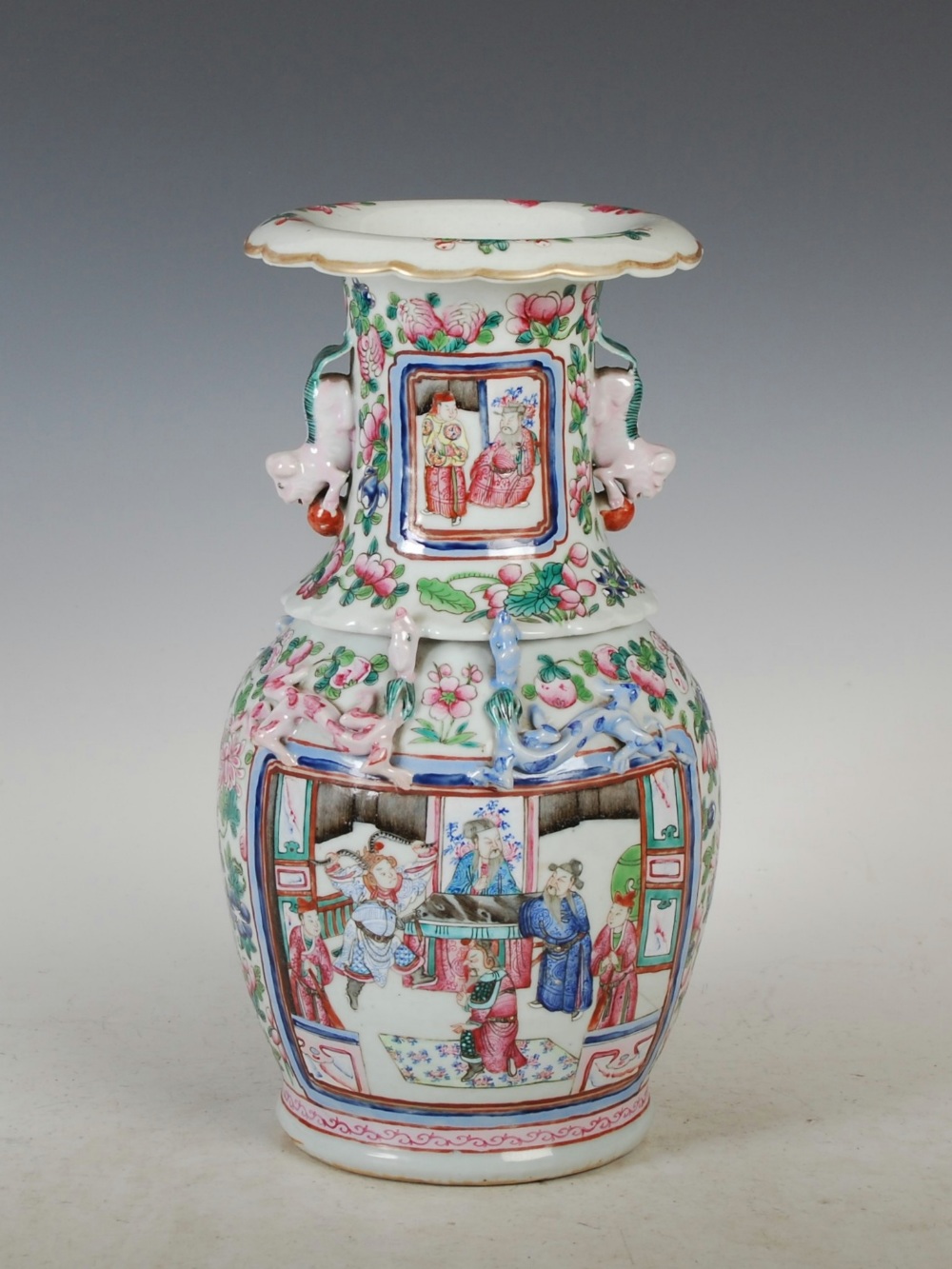 A Chinese porcelain famille rose vase, Qing Dynasty, decorated with panels of Court figures, the