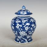 A Chinese porcelain blue and white jar and cover, late Qing Dynasty, decorated with prunus blossom