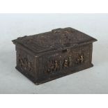 A late 19th century bronze casket, decorated in relief with panels of figures and tavern scenes,