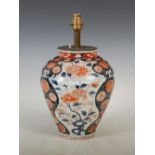 A Japanese Imari vase, Edo Period, decorated with peony and chrysanthemum, converted to a table