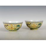 A pair of Chinese porcelain yellow ground dragon bowls, six character Kangxi marks but later,