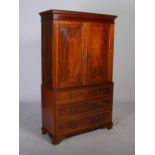 An Edwardian mahogany and satinwood banded linen press, the moulded cornice and dentil frieze