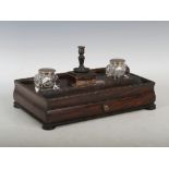 A 19th century silver mounted oak presentation desk stand, the rectangular top with two concave