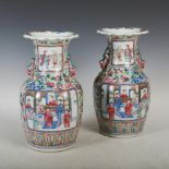 A pair of Chinese porcelain famille rose vases, Qing Dynasty, decorated with panels of Court figures