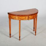 A 19th century satinwood and marquetry inlaid demi lune card table in the George III style, the