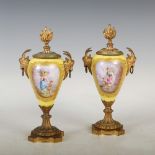 A pair of late 19th century porcelain and ormolu mounted castellets, the yellow ground porcelain