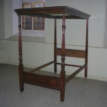 A late 19th century mahogany four poster single bed, the canopy with a moulded edge and dentil