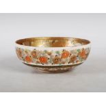 A Japanese Satsuma pottery bowl, Meiji Period, decorated with a central roundel of mothers and