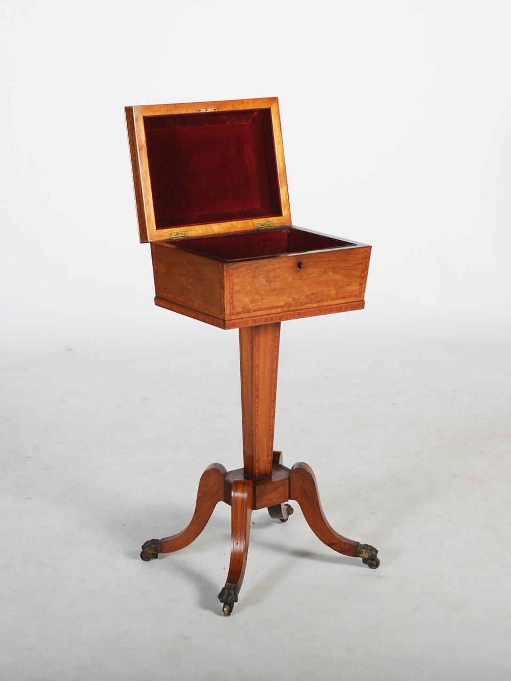 A 19th century rosewood and satinwood banded tea poy, the sarcophagus shaped top with a hinged cover - Image 2 of 3