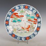 A Japanese Imari charger, late 19th/ early 20th century, decorated with a pair of cranes and