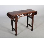 A Chinese dark wood altar table, late 19th/ early 20th century, the panelled rectangular top pierced