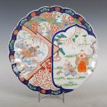 A Japanese Imari charger, late 19th/ early 20th century, with asymmetric panelled decoration of