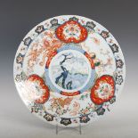 A Japanese Imari charger, late 19th/ early 20th century, decorated with a central roundel of leaping