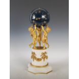 A late 19th century French ormolu and marble mantle clock, the blue patinated globe dial with