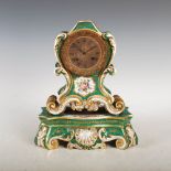 A 19th century Paris porcelain green ground Rococo style mantle clock, the 3 1/4 inch engine