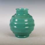 A green ground pottery vase designed by Keith Murray for Wedgwood, printed marks and facsimile