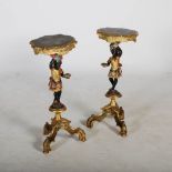 A pair of polychrome and gilded Blackamoor jardiniere stands, carved with female figures