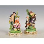 A pair of early 19th century Derby figure groups, circa 1825-40, modelled with figures before