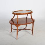 An Edwardian mahogany, satinwood banded and marquetry inlaid etagere, the oval shaped upper tier