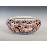 A Japanese Imari oval shaped jardiniere, Meiji Period, decorated with panels of peony, flowering