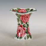 A Wemyss pottery Lady Eva vase, decorated with roses and foliage under a green line rim, green