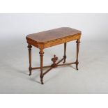 A Victorian walnut, boxwood lined and ebonised card table, the hinged and revolving rectangular