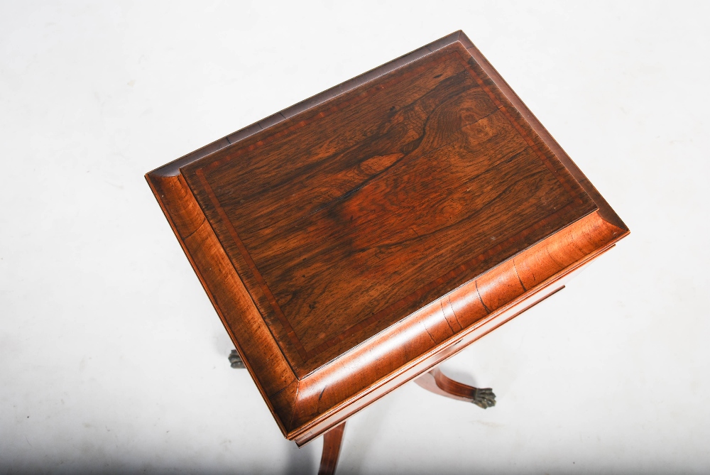 A 19th century rosewood and satinwood banded tea poy, the sarcophagus shaped top with a hinged cover - Image 3 of 3