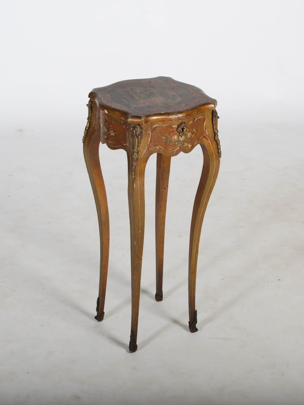 A late 19th/ early 20th century French painted occasional table, the hinged top decorated with