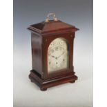 An early 20th century mahogany cased Westminster chime bracket clock, the silvered dial with