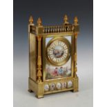 A late 19th century French gilt metal and porcelain mounted mantle clock, the circular dial with