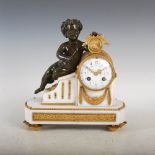 A late 19th century French bronze and marble mantle clock, the 3 1/2" circular convex enamel dial