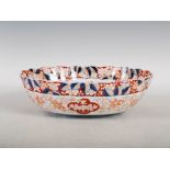 A Japanese Imari oval-shaped bowl, late 19th/ early 20th century, decorated with a central oval