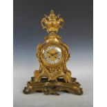An imposing 19th century French ormolu mantle clock in the Rococo style, the circular dial with