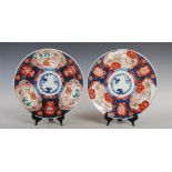 A pair of Japanese Imari dishes, late 19th/ early 20th century, decorated with central blue and