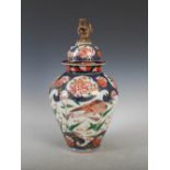 A Japanese Imari jar and cover, late 19th/ early 20th century, decorated with geese, peony and