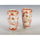 A pair of Japanese Kutani vases, late 19th/ early 20th century, decorated with shaped panels of