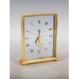 A Jaeger-Le Coultre mantle clock, the movement and batons suspended within tow glass plates,