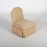 A late 19th/ early 20th century mahogany nursing chair by Howard & Sons, the arched back and