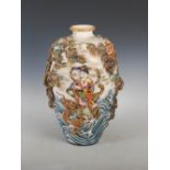 A Japanese Satsuma pottery vase, Meiji Period, decorated in relief with immortals, oni, dragon, pine