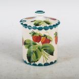 A Wemyss pottery preserve jar and cover, decorated with strawberries within green dentil borders,