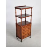 A 19th century rosewood what-not, with three open tiers above four long graduated drawers with