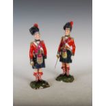 A pair of Sitzendorf porcelain figures modelled as Officers of The Black Watch, 26.5cm high.